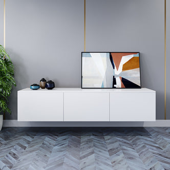 Luxo Bryan Floating Entertainment Unit – Pure White displayed with sleek, handle-less cabinets, showcasing its modern, space-saving design on a wall, complemented by a plant and white cabinet with a black frame.
