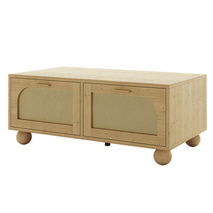 Carlo 110cm Rattan Coffee Table with Storage in Natural, featuring a low rectangular wooden design with woven cane panels on two front doors, simple wooden handles, and ball-shaped wooden feet.