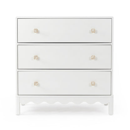 White three-drawer dresser with gold flower knobs on white background