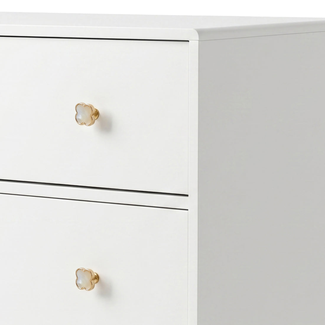 White three-drawer dresser with gold flower knobs on white background