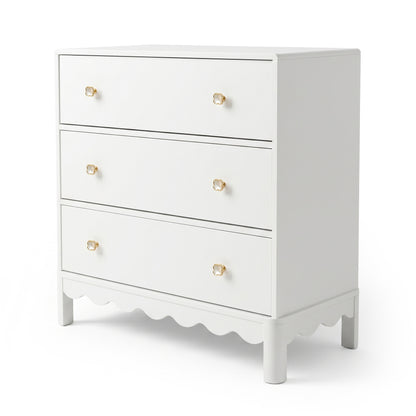 White three-drawer dresser with gold flower knobs on white background