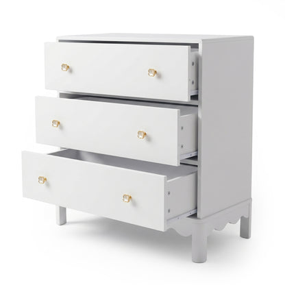 White three-drawer dresser with gold flower knobs on white background