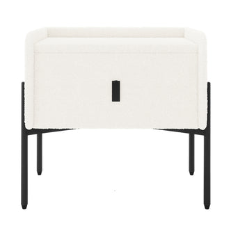 Eliz Boucle Fabric Bedside Table in Cream White, featuring a cuboid shape with boucle upholstery, a centered drawer with black pull, and sleek black metal legs, embodying contemporary elegance.