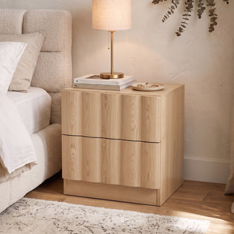 Hamish 2 Drawer Fluted Bedside Table in Oak styled in a room setting