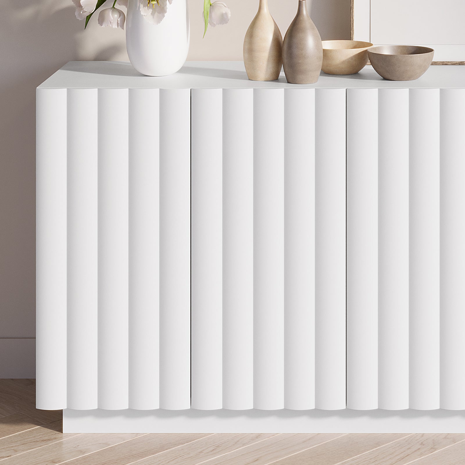 Close-up of Hamish 140cm Storage Sideboard Buffet White, showcasing its modern wave design, handle-free doors, and ample top space for displaying décor, with sleek, clean lines for a contemporary look.