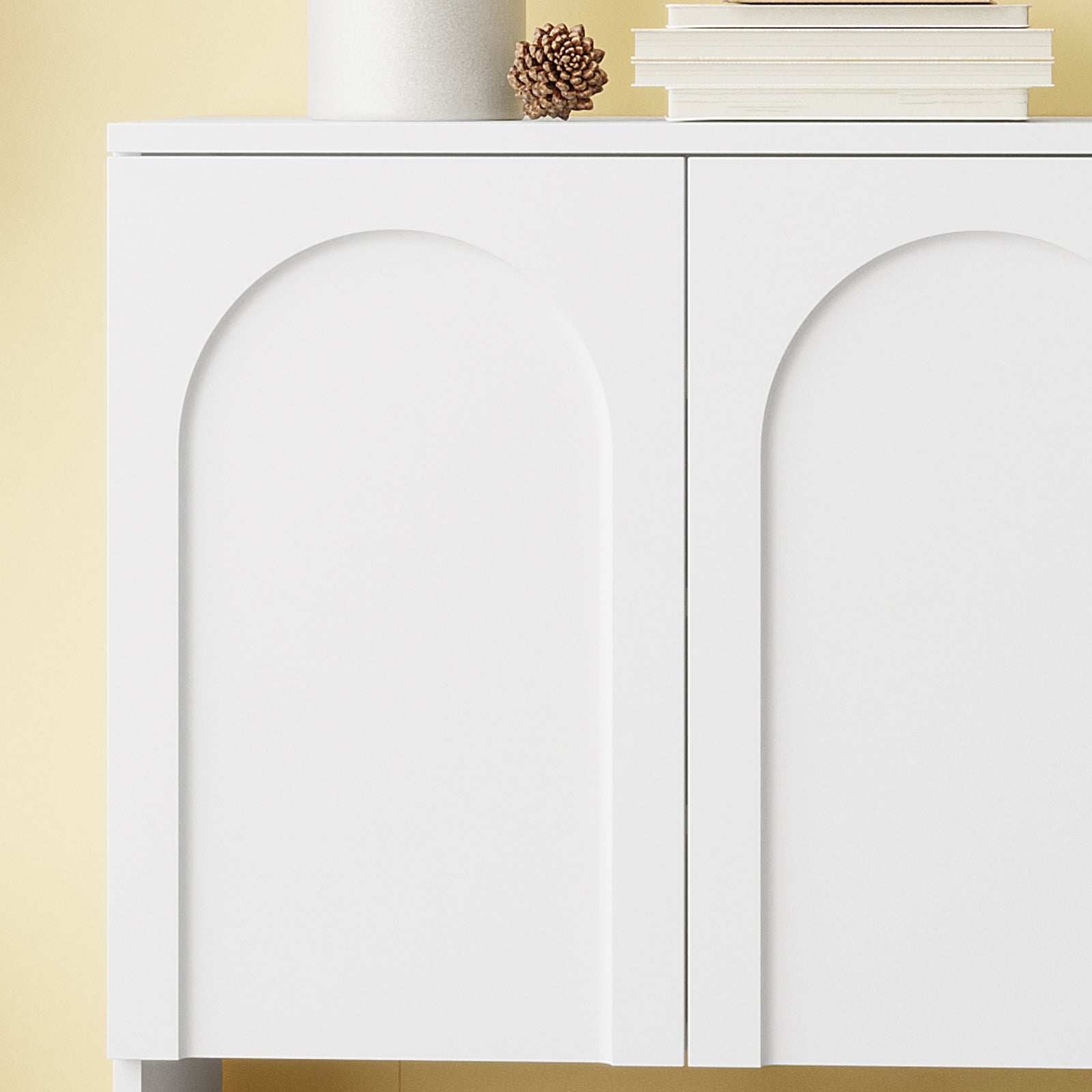 Hava 80cm Arched Shoe Cabinet White displayed with arched design, clean lines, and a top surface featuring a candle and books, offering ample storage for hallway organization.