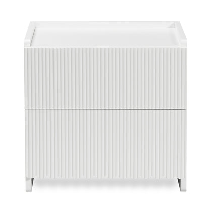 Nasrin 2 Drawer Bedside Table in White, featuring a matte finish, vertical ribbed drawer fronts, low-lip top surface, and short legs, offering modern elegance and functionality.