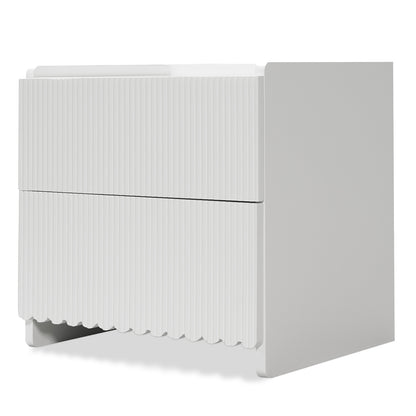 Nasrin 2 Drawer Bedside Table in White features a modern design with fluted drawer fronts and hidden legs, offering a minimalist look and practical storage for contemporary bedrooms.
