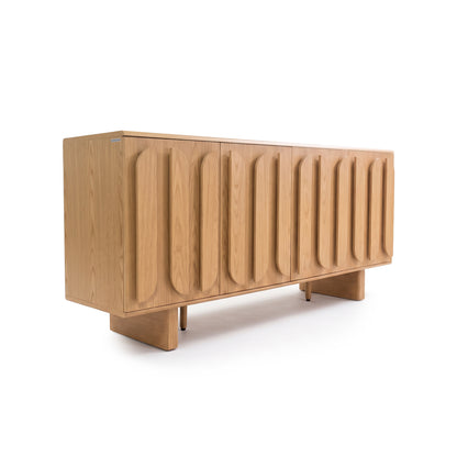 Modern wooden sideboard with vertical carved panel doors on a white background