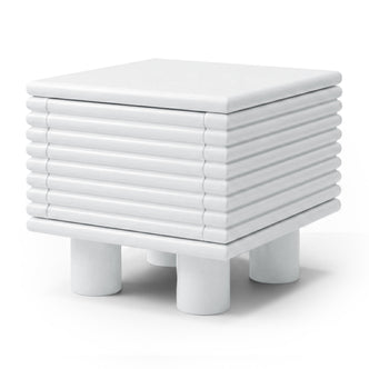 White modern side table with ribbed texture on a white background