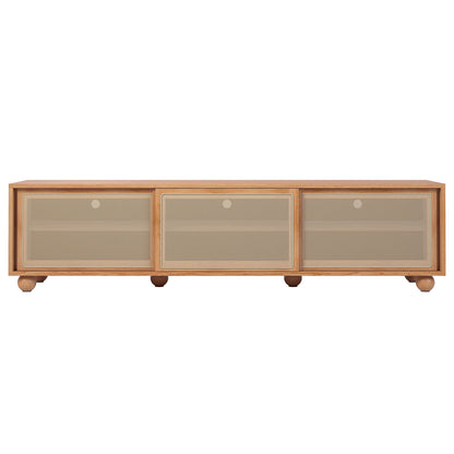 Thea 200cm Solid Oak Rattan Entertainment Unit - Natural features visible sturdy timber legs, a mesh door, and rattan sliding doors, combining elegance and practicality in its robust wooden design.