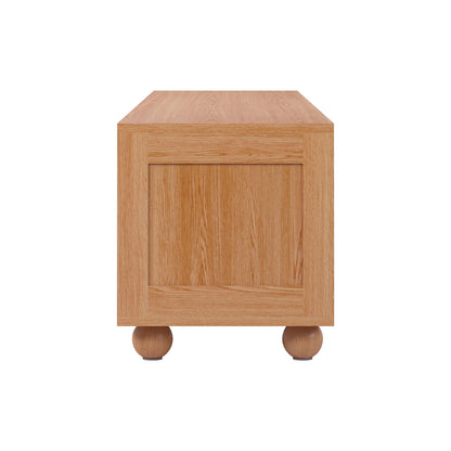 Thea 200cm Solid Oak Rattan Entertainment Unit - Natural features a close-up of its solid oak surface and rattan sliding doors, showcasing elegant design and practical storage in fine wooden craftsmanship.
