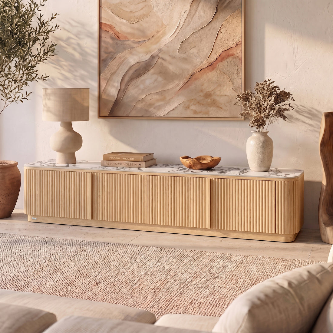 Natural wood TV unit with ribbed doors, marble-look top, rounded edges in styled living room