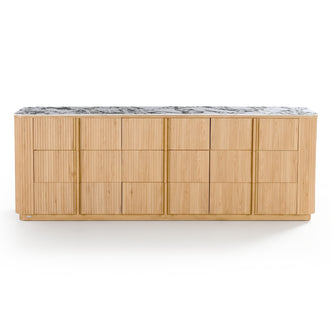 Light oak sideboard with sintered stone marble-look top, rounded edges, and vertical groove detailing on cabinet doors