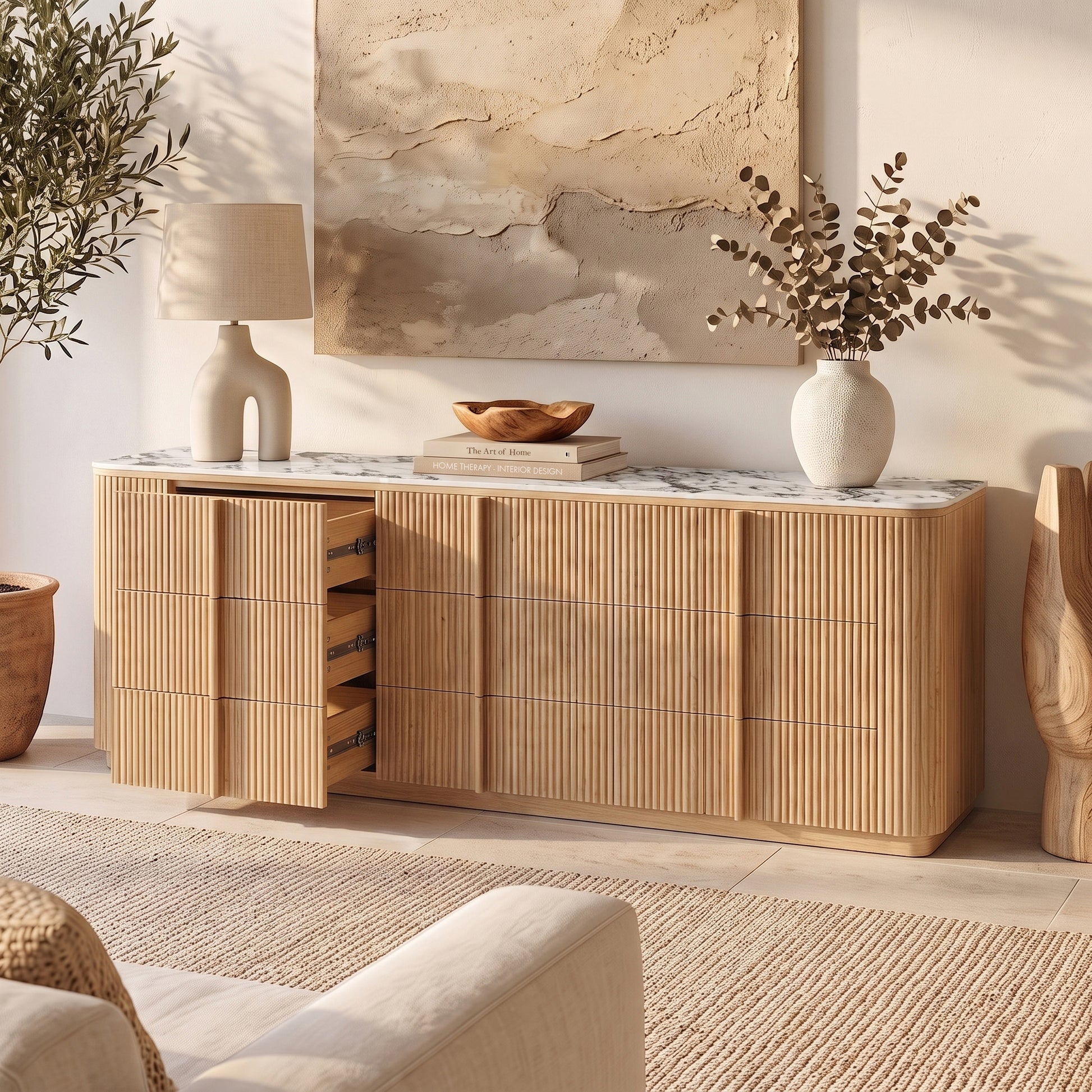 Natural wood sideboard with sintered stone top and open drawers in styled living room