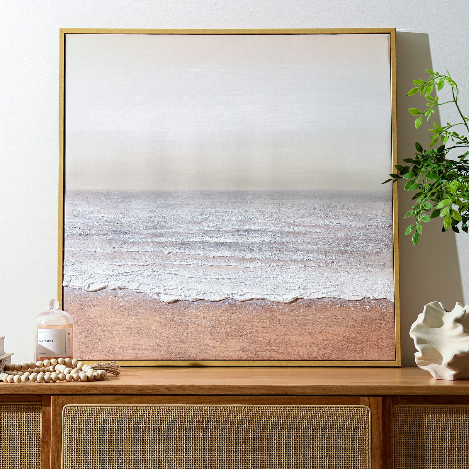 Sable Textured Coastal Canvas Wall Art displayed in a modern living room, showcasing its serene coastal aesthetic and how it enhances a beach-inspired or minimalist interior.