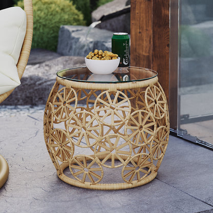 Aarani Round Rattan Side Table - Natural featuring intricate PE rattan weaving and a sleek tempered glass top, set against a simple background highlighting its elegant round shape and durable design.