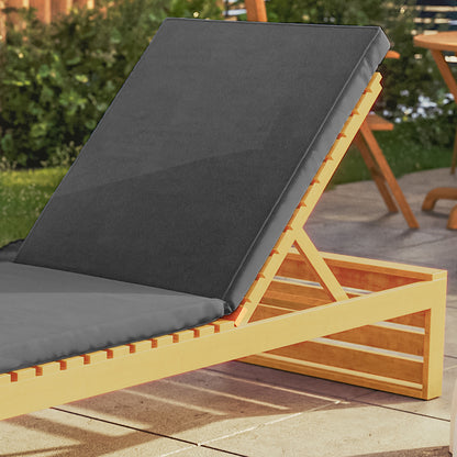 Alabat Acacia Wood Outdoor Sun Lounger with Cushion in Grey on paved patio, featuring an adjustable backrest and plush cushion, with garden greenery and a wooden chair faintly visible in the background.