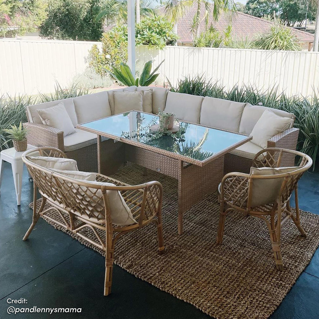 Ballena 6 Seater Wicker Outdoor Dining Sofa Set – Beige/Light Beige displayed with cushioned wicker seating and a glass-topped table with a houseplant, set on a patio for stylish outdoor dining.