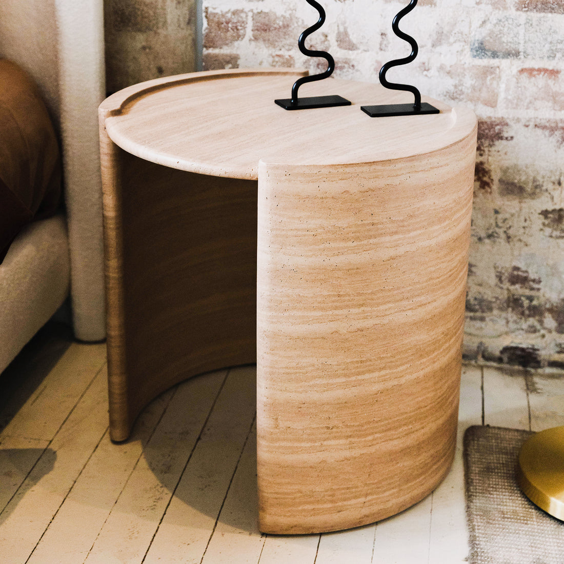 Behnaz 56cm Round Indoor/Outdoor Concrete Side Table Beige with arched base, showcasing its modern design and robust construction, ideal for versatile use in covered outdoor or indoor spaces.