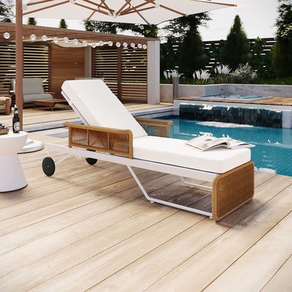 Boonoo Premium Aluminium Outdoor Rattan Sun Lounger near a pool, showcasing its sleek design with adjustable reclining positions and plush cushions, highlighting its blend of comfort and style for outdoor relaxation.