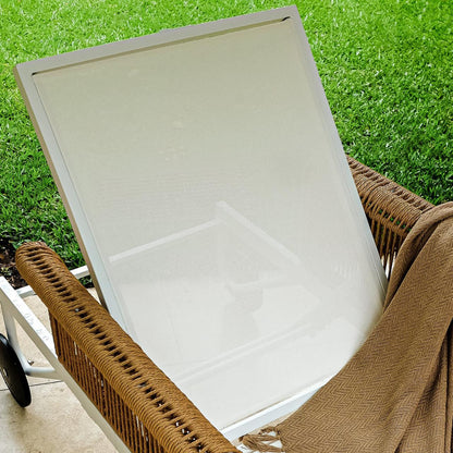 Boonoo Premium Aluminium Outdoor Rattan Sun Lounger - Cream White, showcasing its elegant rattan weave and plush cushions, set amidst an outdoor setting, highlighting its luxurious and adjustable reclining design.