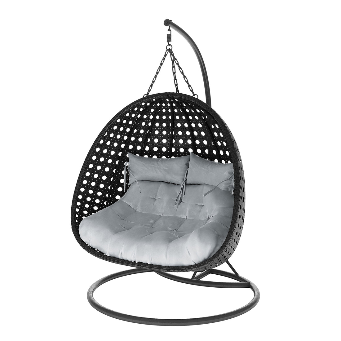 Buena 2 Person Wicker Outdoor Hanging Egg Chair in Black, features a freestanding rattan shell suspended by chains, with a round metal base and curved arm, housing thick tufted cushions for comfort.