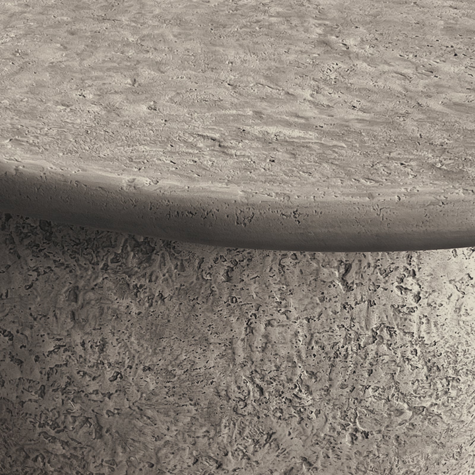 Cam Indoor & Outdoor Round Concrete Coffee Table – Stone, featuring a robust, weatherproof design with a textured, organic round shape. Perfect for modern farmhouse aesthetics in both indoor and outdoor settings.