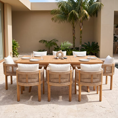 Outdoor dining set staged on a patio with tropical plants