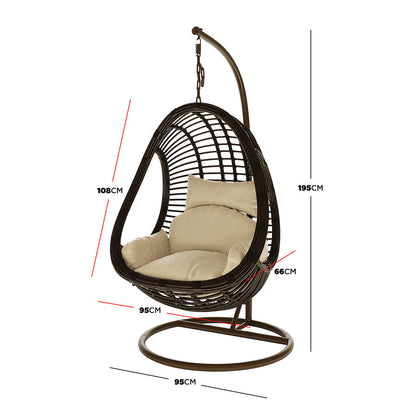 Deanna Curved Rattan Hanging Outdoor Egg Chair in Brown, featuring a dark woven frame, curved metal stand, and plush cushion, highlighted with red/black dimension call-outs, ideal for versatile indoor/outdoor seating.
