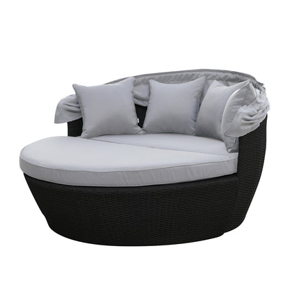 Erith Wicker Outdoor Furniture Day Bed w/ Canopy featuring a plush futon pad on a sturdy wicker frame, complemented by a protective canopy, offering a luxurious outdoor relaxation experience.