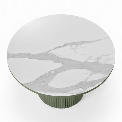 Evone 4 Seater Stone Outdoor Dining Table Set features a white marble tabletop with gray veining on a muted green, fluted pedestal base, ideal for modern outdoor dining.