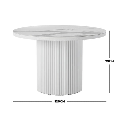 White round dining table with a 120cm marble-patterned stone top and a 75cm high fluted pedestal base.