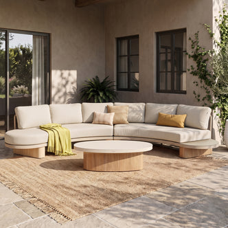 Outdoor sectional sofa set with coffee table styled on a patio