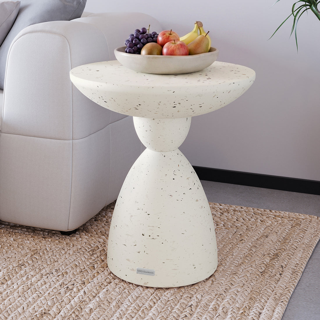 Junia Terrazzo Concrete Pedestal Side Table styled in a contemporary living room, perfect for indoor outdoor use - Lifestyle