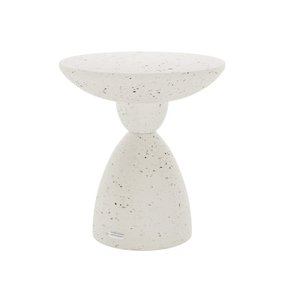 Angled view of Junia Terrazzo Indoor Outdoor Pedestal Concrete Side Table, showcasing its unique silhouette and texture
