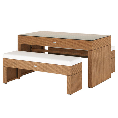 Kummi 4 Seater Outdoor Dining Bench Set showcases a honey-brown rattan table with dark glass top and two cushioned benches underneath, perfect for stylish and comfortable outdoor gatherings.