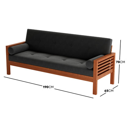 Luxo Meves Timber Outdoor Sofa Bed Black features a black-cushioned sofa with a foldable backrest, crafted from durable Eucalyptus wood, highlighting a button-tufted design and accompanying round pillows for outdoor comfort.