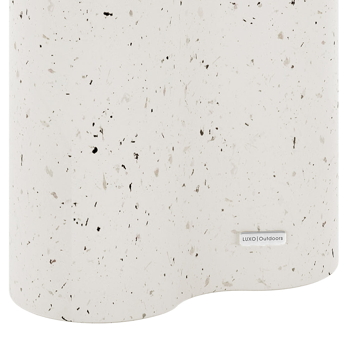 Detail shot of the Odalys Terrazzo concrete side table surface, featuring the Luxo Outdoors tag