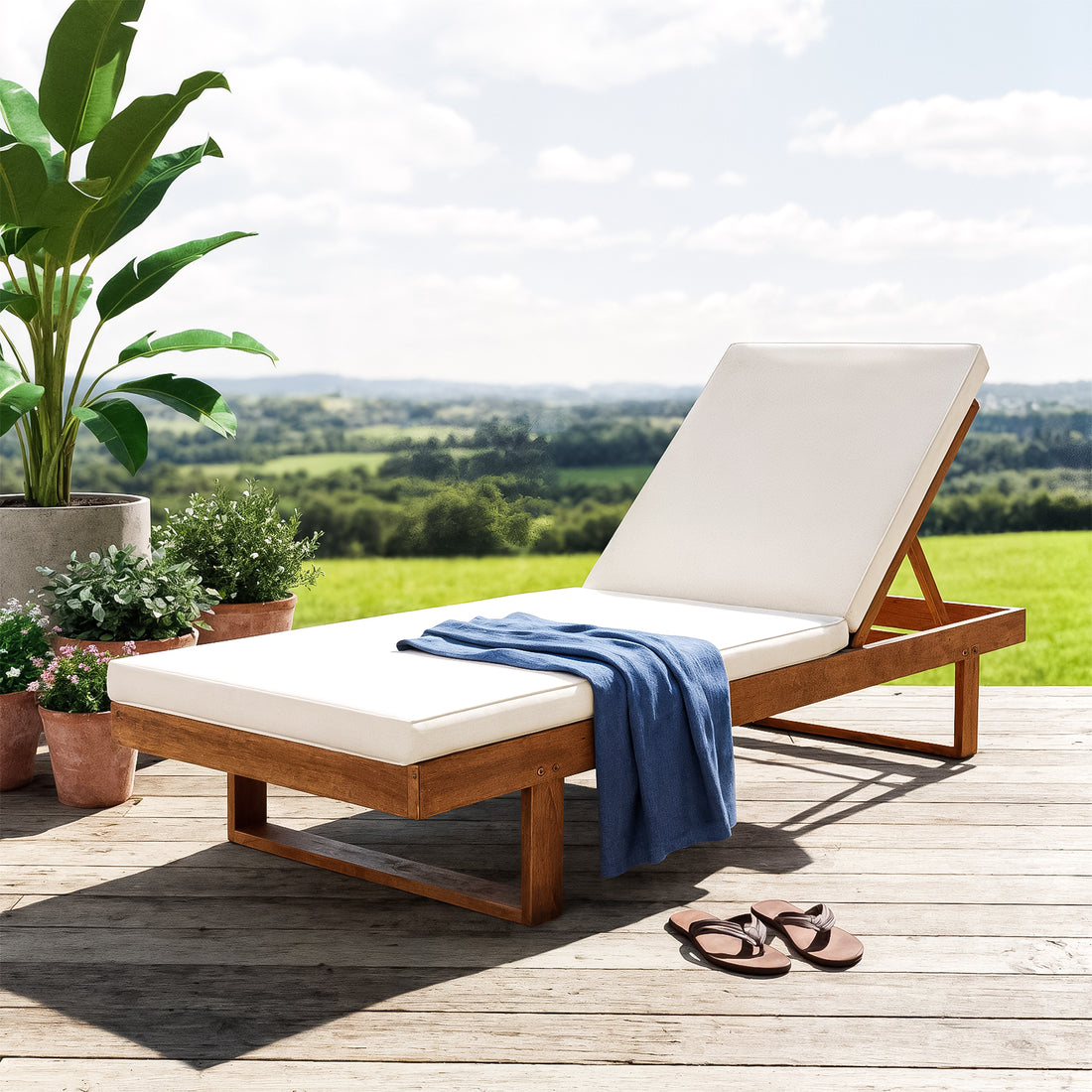 Panay Solid Outdoor Sun Lounger Set of 2 in Cream Timber, featuring a white cushion and adjustable backrest, paired with a blue throw, surrounded by potted plants on a wooden deck.
