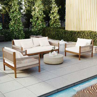 Savin & Myrtle Outdoor Sofa Set with Coffee Table in Beige features a two-seater sofa, two armchairs with woven sides, and a stone coffee table, all set by a pool.