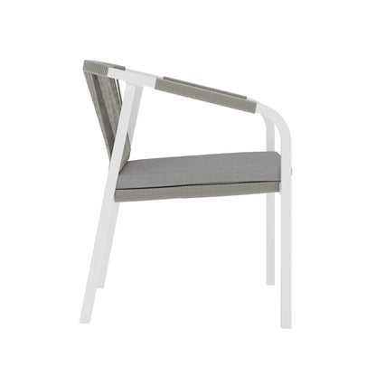 Vernon 6 Seater Aluminium Wicker Outdoor Dining Set Grey features a close-up view of a chair with a cushion, highlighting its elegant wicker design and plush seating.