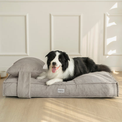 Dax Extra Large Corduroy Dog Bed – Grey Comfort features a plush, raised bolster design providing neck support, shown with a relaxed dog lying comfortably, highlighting its ample size and soft structure.