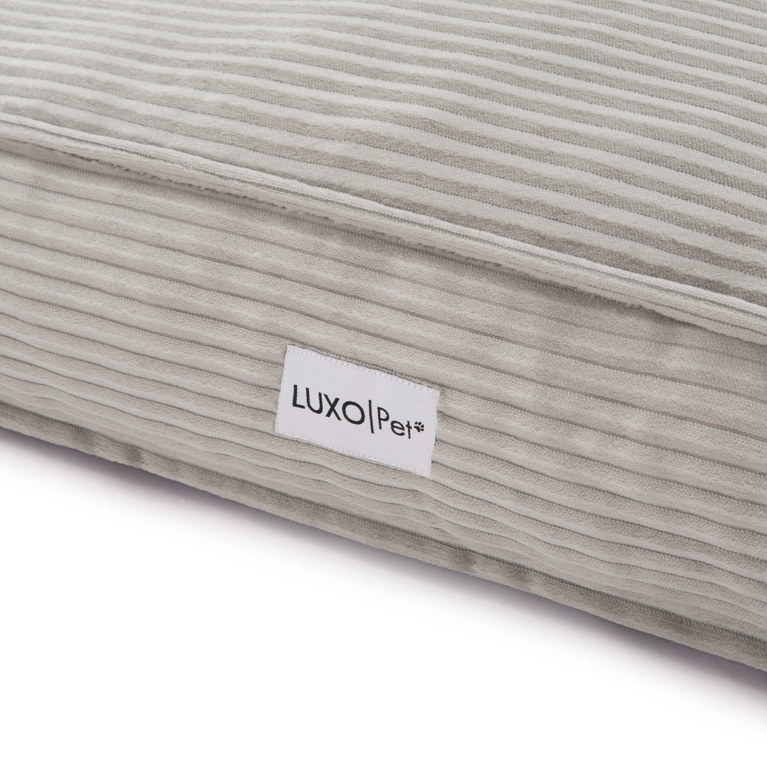 Dax Extra Large Corduroy Dog Bed – Grey Comfort; close-up highlights soft corduroy texture and plush filling, showcasing raised bolster sides for neck support and a non-slip base for stability.