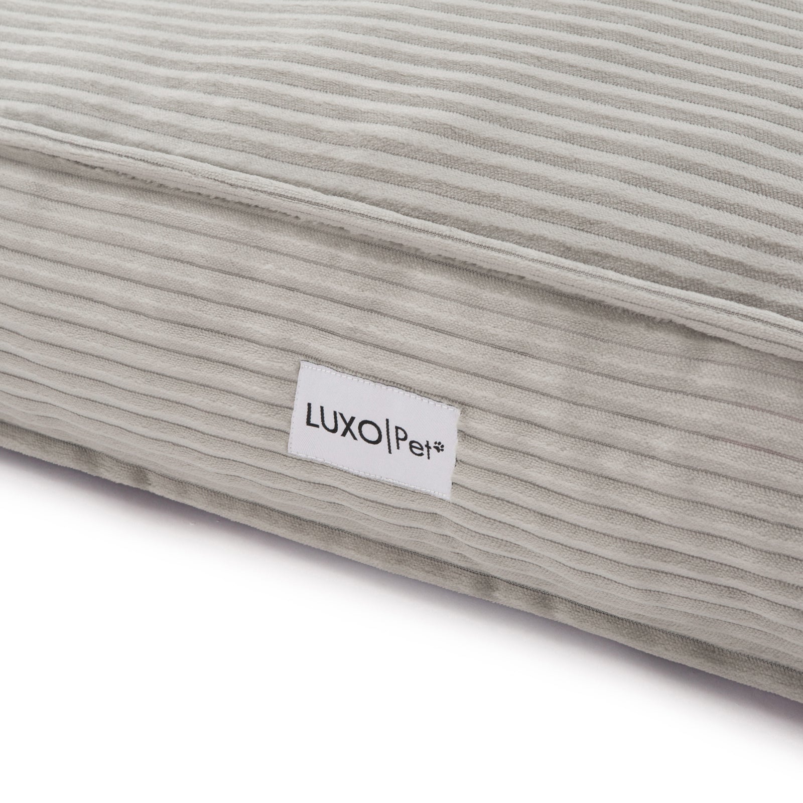 Dax Extra Large Corduroy Dog Bed – Grey Comfort; close-up highlights soft corduroy texture and plush filling, showcasing raised bolster sides for neck support and a non-slip base for stability.