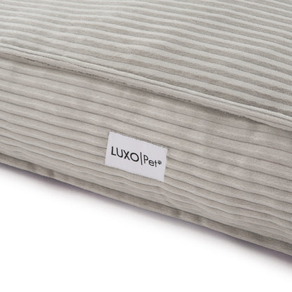 Dax Extra Large Corduroy Dog Bed – Grey Comfort; close-up highlights soft corduroy texture and plush filling, showcasing raised bolster sides for neck support and a non-slip base for stability.