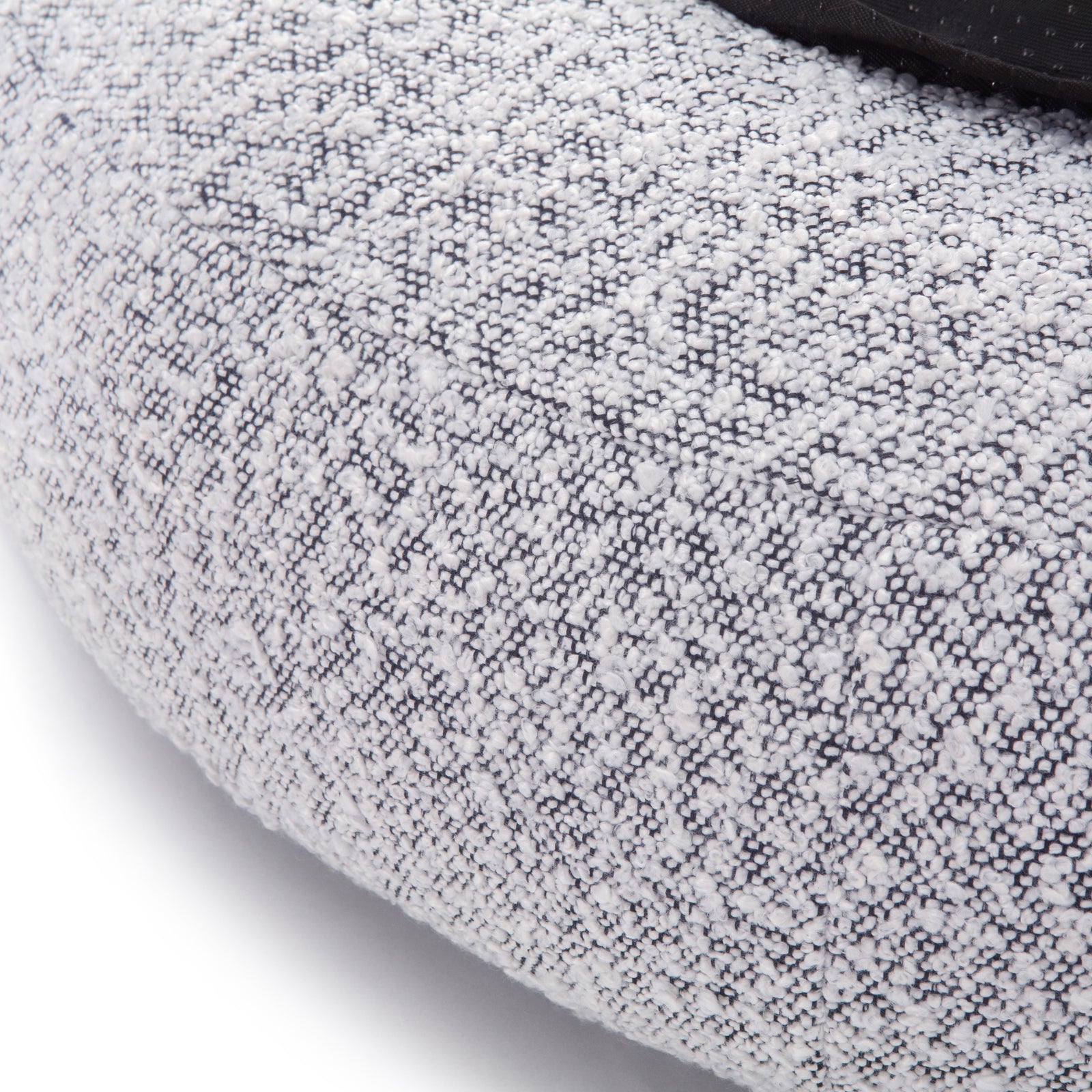 Kyra Medium Boucle Pet Bed – White with Black Base showcasing close-up of textured boucle fabric with visible stitches, highlighting plush support and ergonomic raised bolsters for pet comfort.