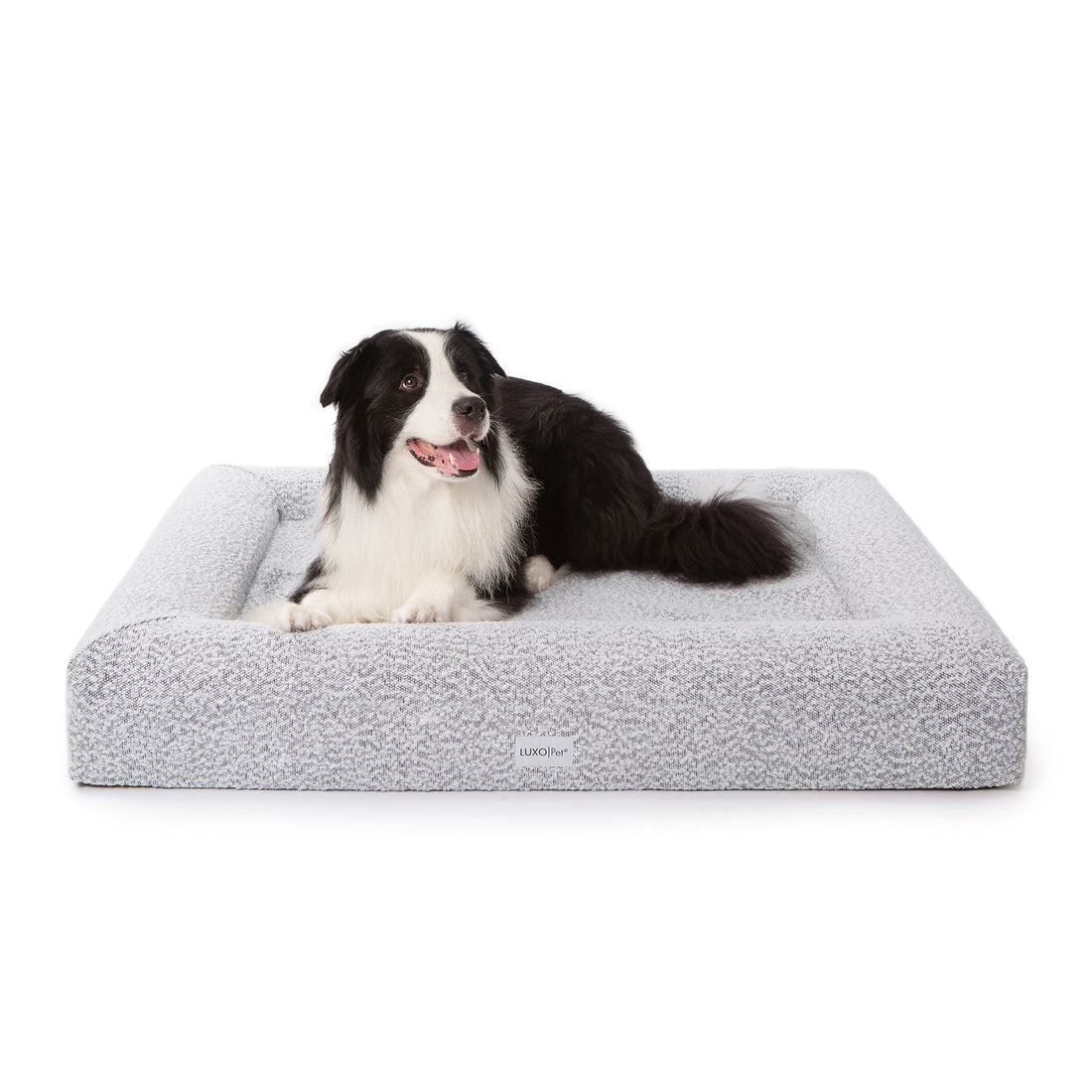 Tyro Luxe Large Orthopedic Pet Bed – Black & White, featuring high-density memory foam and boucle fabric, provides stylish, supportive comfort for large dogs, ensuring joint relief and stability with a non-slip base.