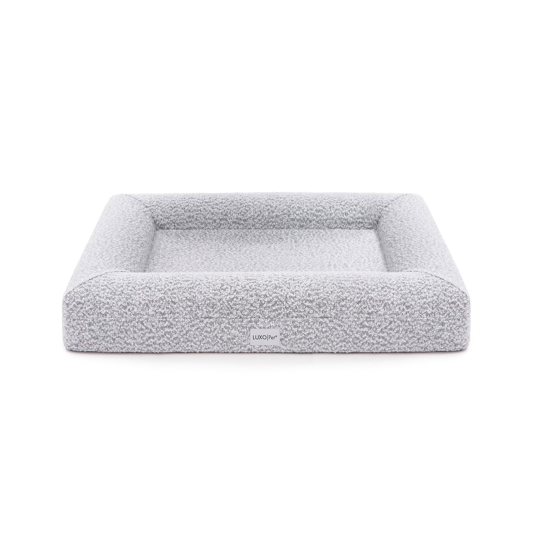 Close-up of Tyro Luxe Medium Orthopedic Pet Bed featuring a textured boucle cover, showcasing its plush, supportive surface designed for medium-sized pets, with visible memory foam contours for joint support.