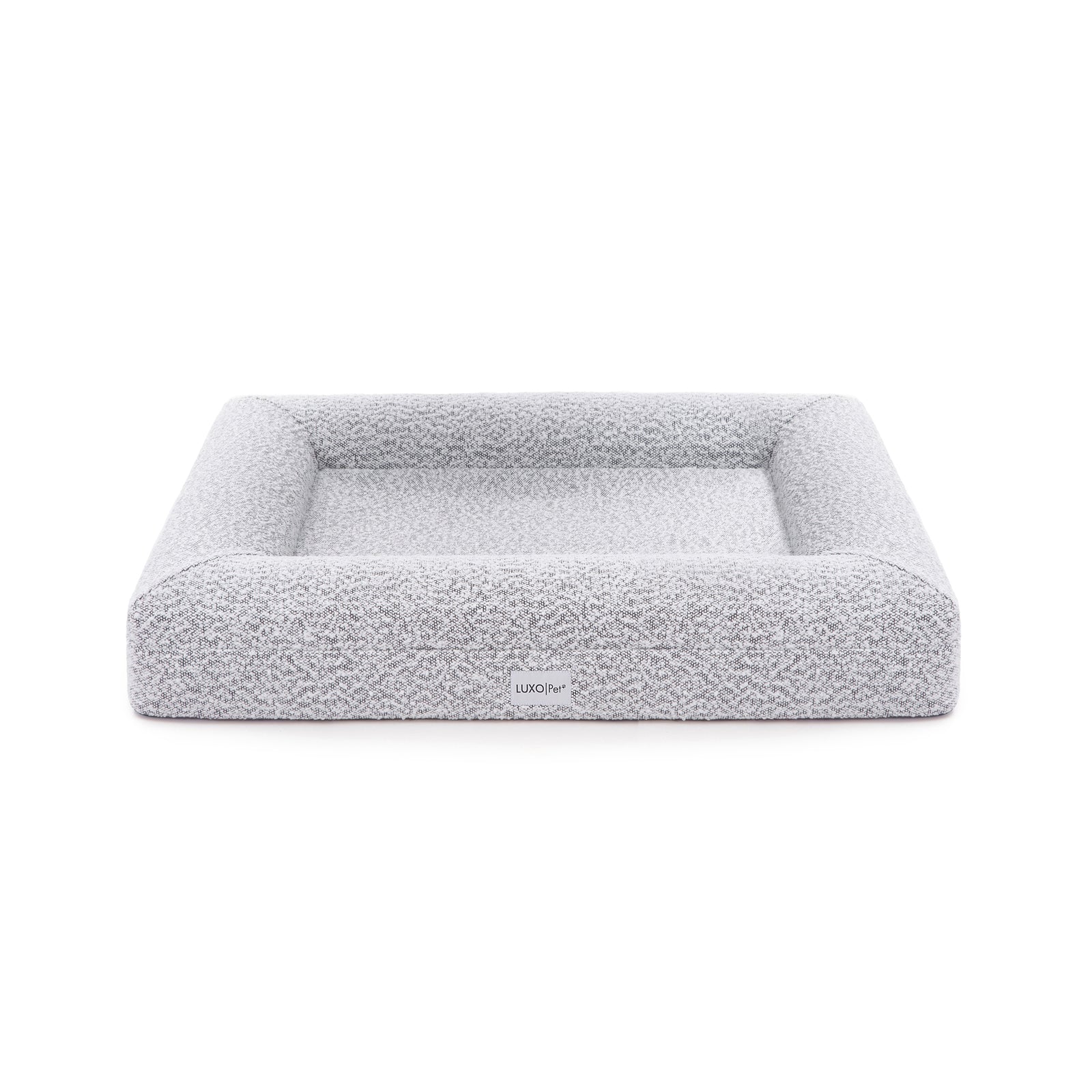 Close-up of Tyro Luxe Medium Orthopedic Pet Bed featuring a textured boucle cover, showcasing its plush, supportive surface designed for medium-sized pets, with visible memory foam contours for joint support.